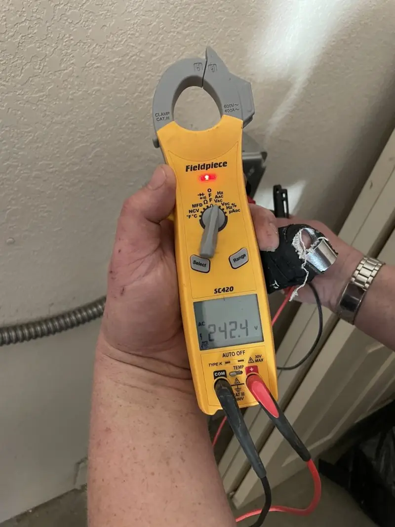 Voltage testing with clamp meter during Aluminum Wiring Replacement in Wake Village